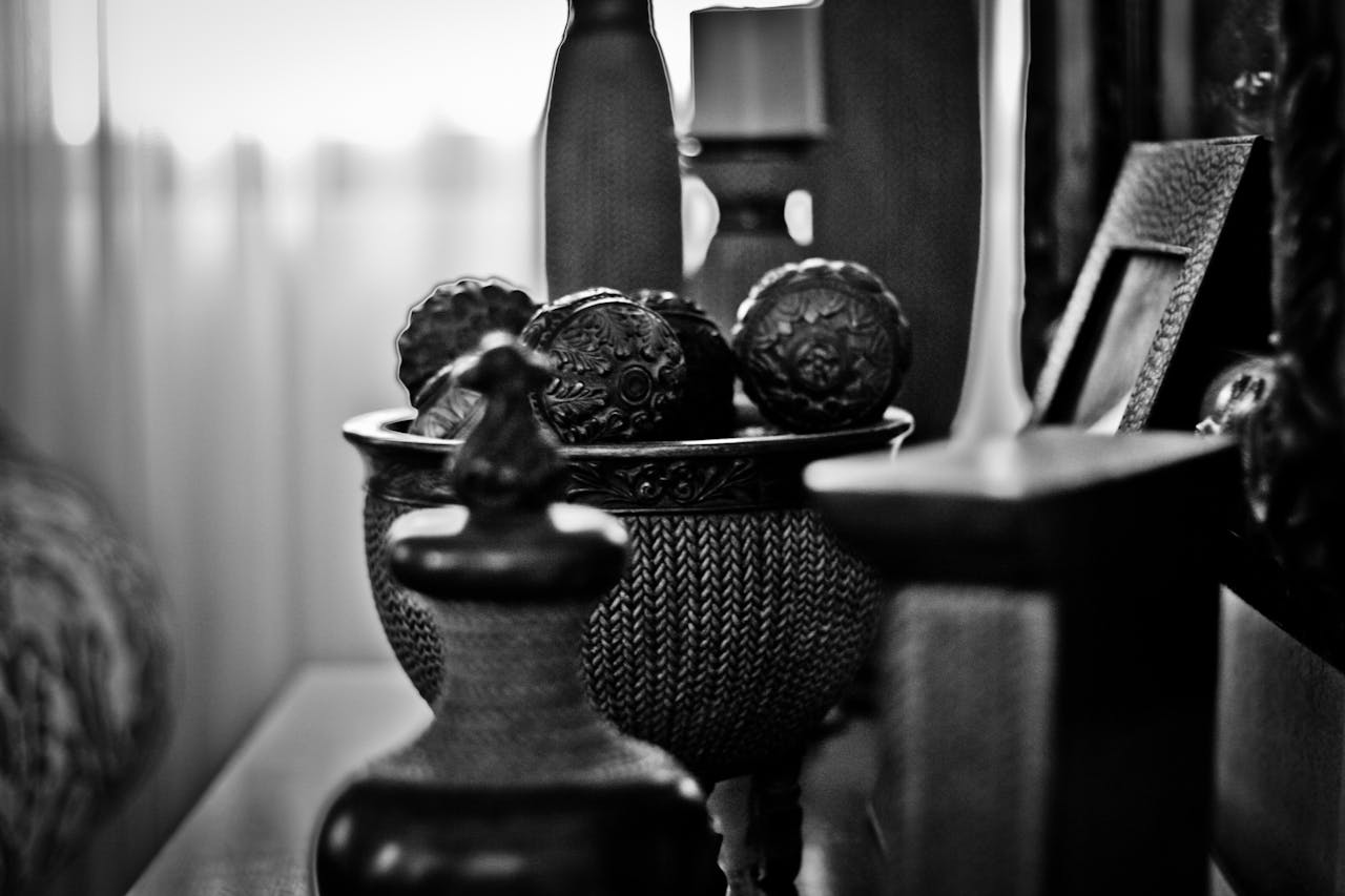 Elegant black and white photograph capturing vintage decor elements with a timeless aesthetic.